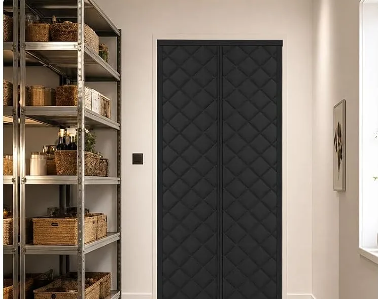 A black FEGO thermal door curtain on a door to the back yard
