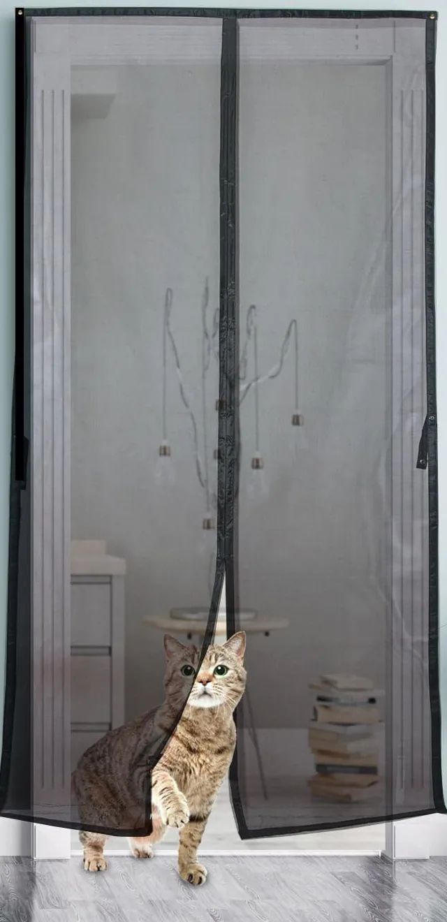 A cat walking through the magnetic seam of a FEGO screen door
